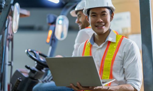engineer staff male warehouse worker in hard hat working. walking through logistics center warehouse factory construction site logistics architect forklife driver man builder indoors background